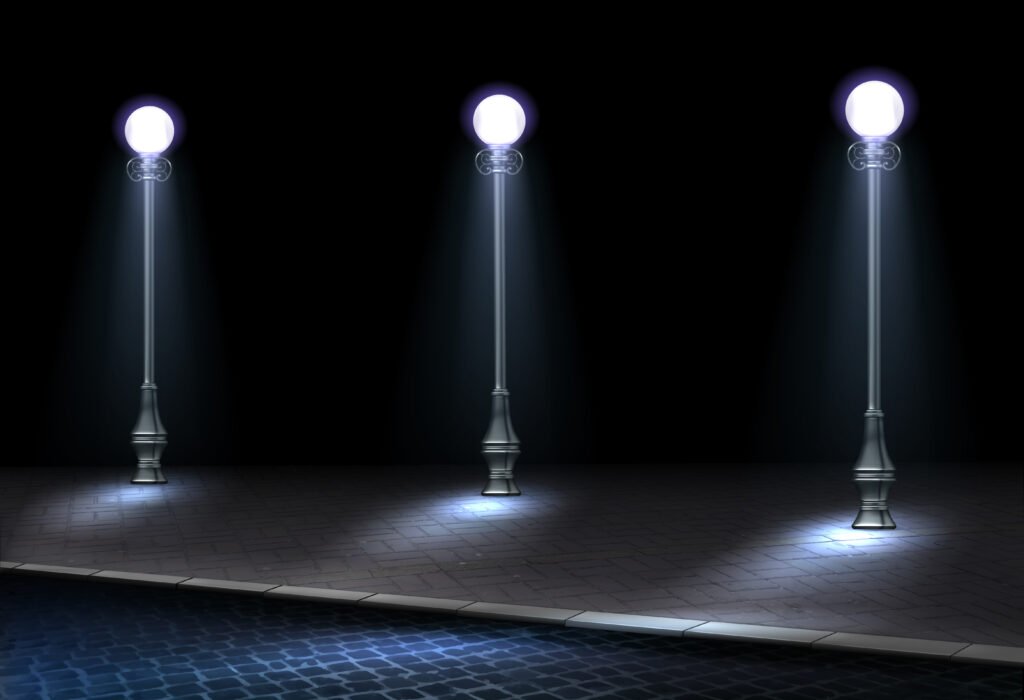Three decorative outdoor smart street lamps illuminating a paved walkway at night, representing automated urban lighting solutions and public infrastructure energy efficiency.